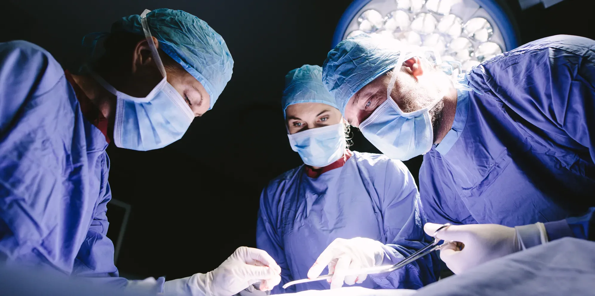 Surgeons operating